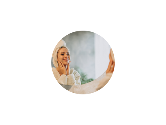 Woman applying Medevox hydrating serum as part of her daily skincare routine, showcasing radiant, healthy skin with natural glow from nourishing ingredients.